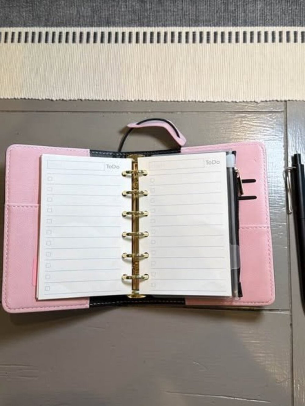 Cute pink and black 6-ring mini planner / organizer with gold-tone rings and inc